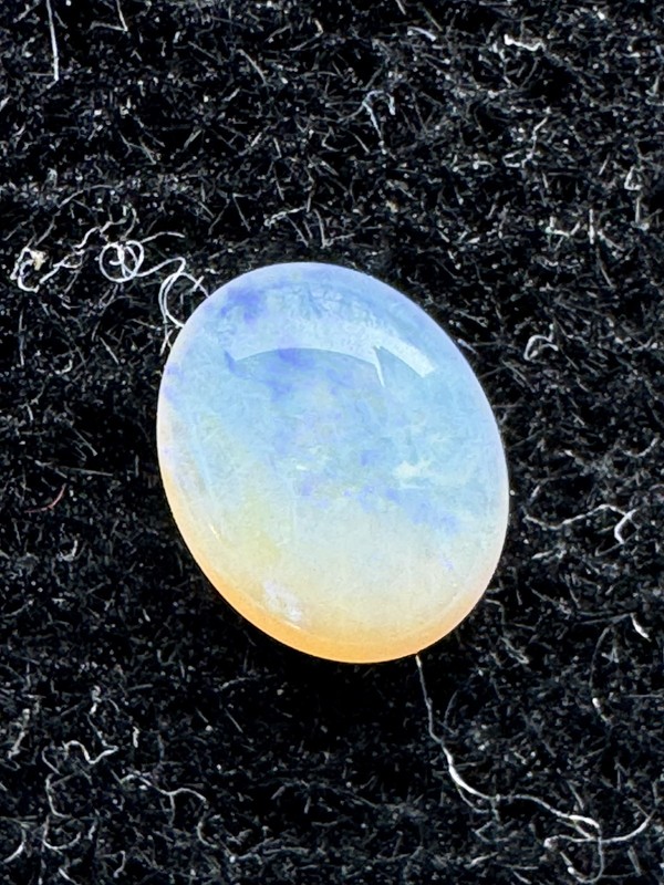 OPAL, Multicolor, 0.22 Carats, 5 x 4 mm, White Oval Cabochon, Clean. #205