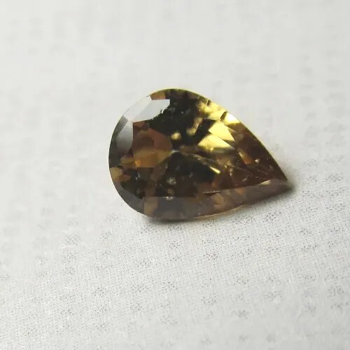 VINTAGE NATURAL Golden Zircon .78 Carat 7mm x 5mm Faceted Pear Cut Gemstone gallery