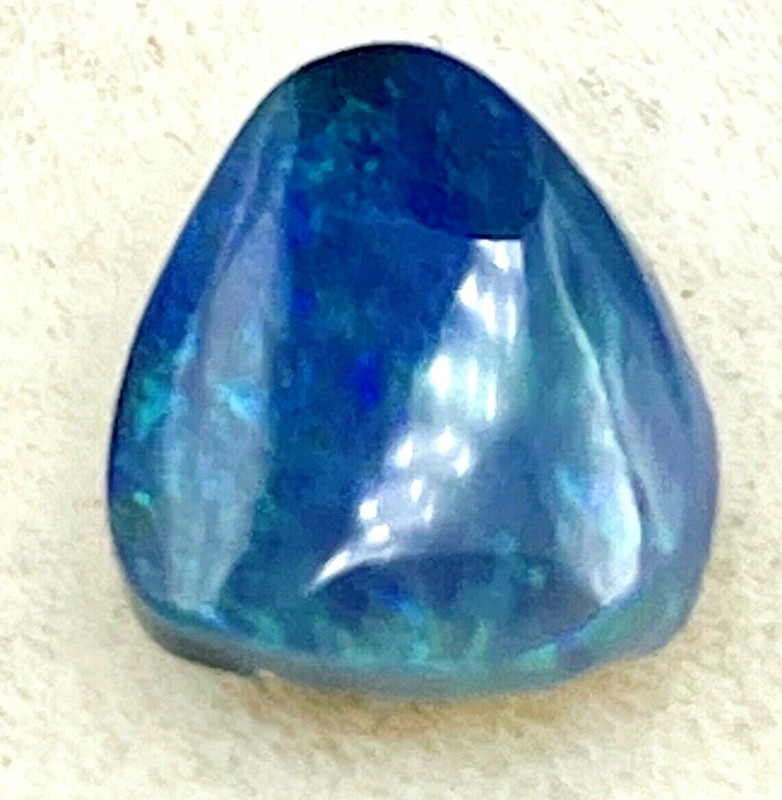 0.80ct natural solid Black Opal, origin Lightning Ridge Australia, 7.5mm x 6.6mm gallery