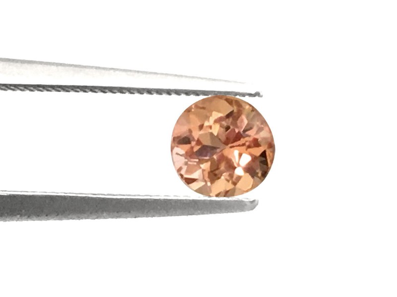 Natural Imperial Topaz pinkish-orange color round shape 0.89 carats