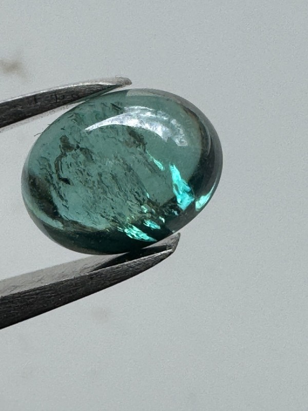 TEAL GREEN TOPAZ, 2.93 TCW, 9×7 mm Teal Green Oval Cab, SI. #209.