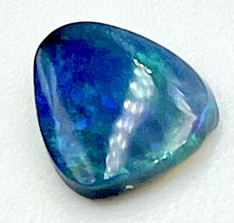 0.80ct natural solid Black Opal, origin Lightning Ridge Australia, 7.5mm x 6.6mm gallery