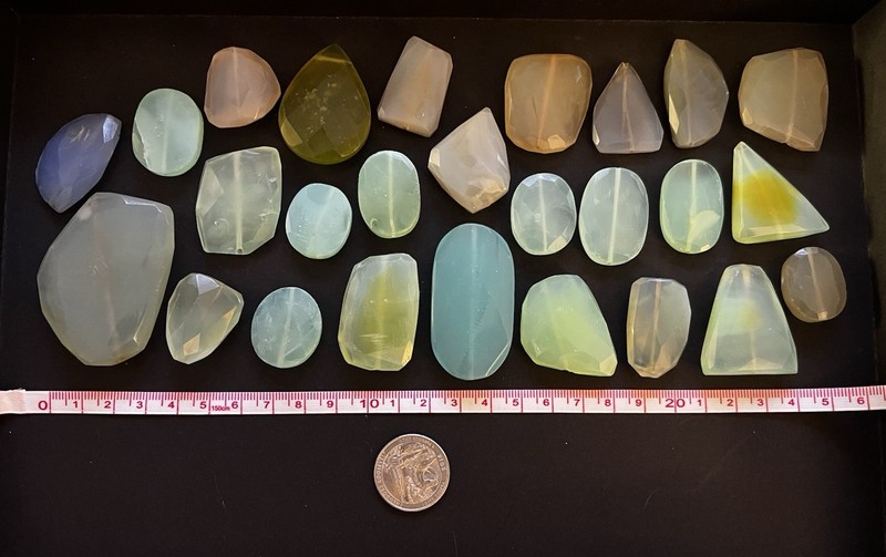 Chalcedony lot, 26 faceted stones, mixed shapes and colors